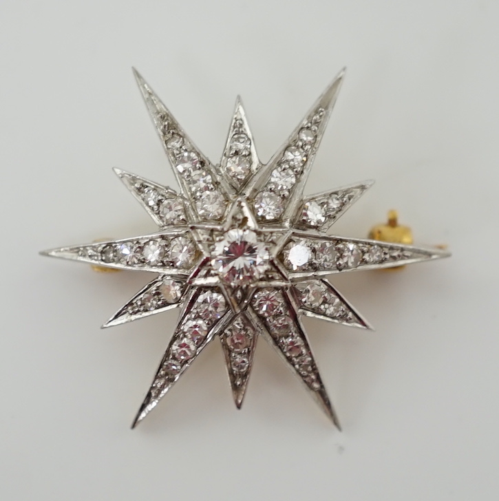 An Edwardian gold and diamond cluster set starburst brooch